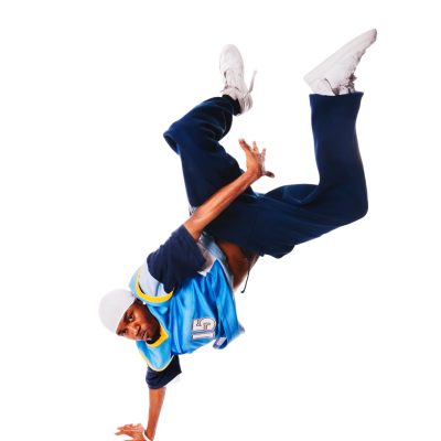 Hip-hop young man making cool move on white background